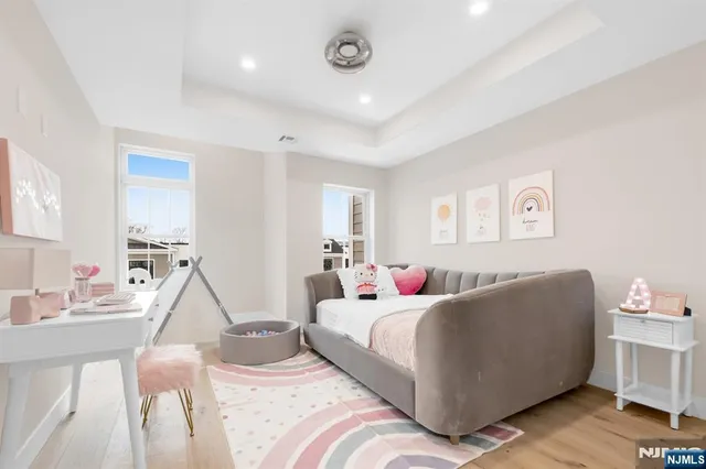 a bedroom with a bed and a couch