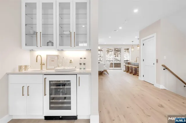 a kitchen with stainless steel appliances granite countertop a stove and cabinets