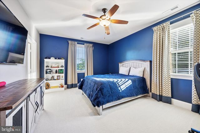 a bed room with a bed and a television