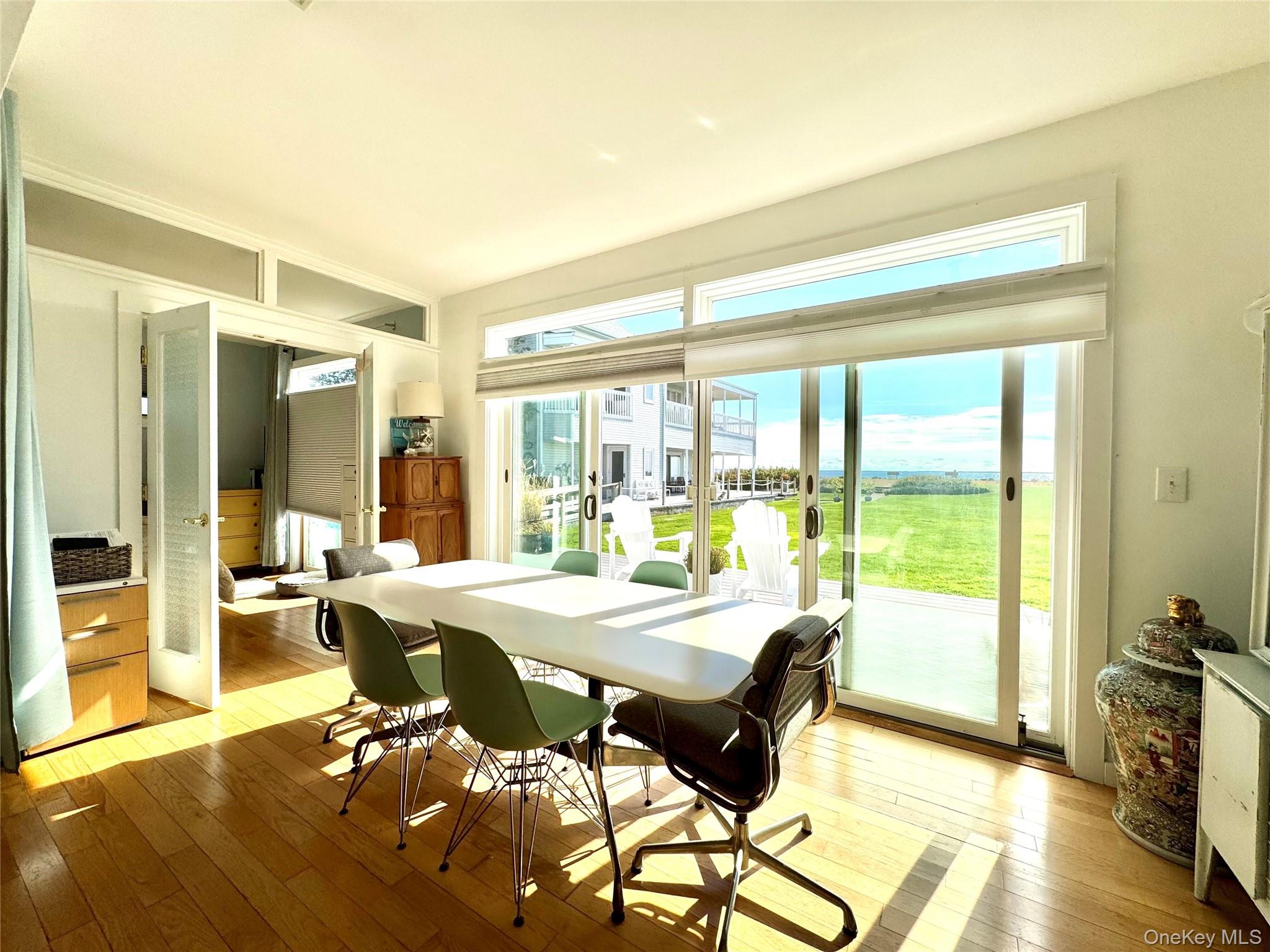 42 Browns River Road, Unit A Sayville, NY 11782 - Photo 8 of 15 a view of a dining room with furniture window and wooden floor