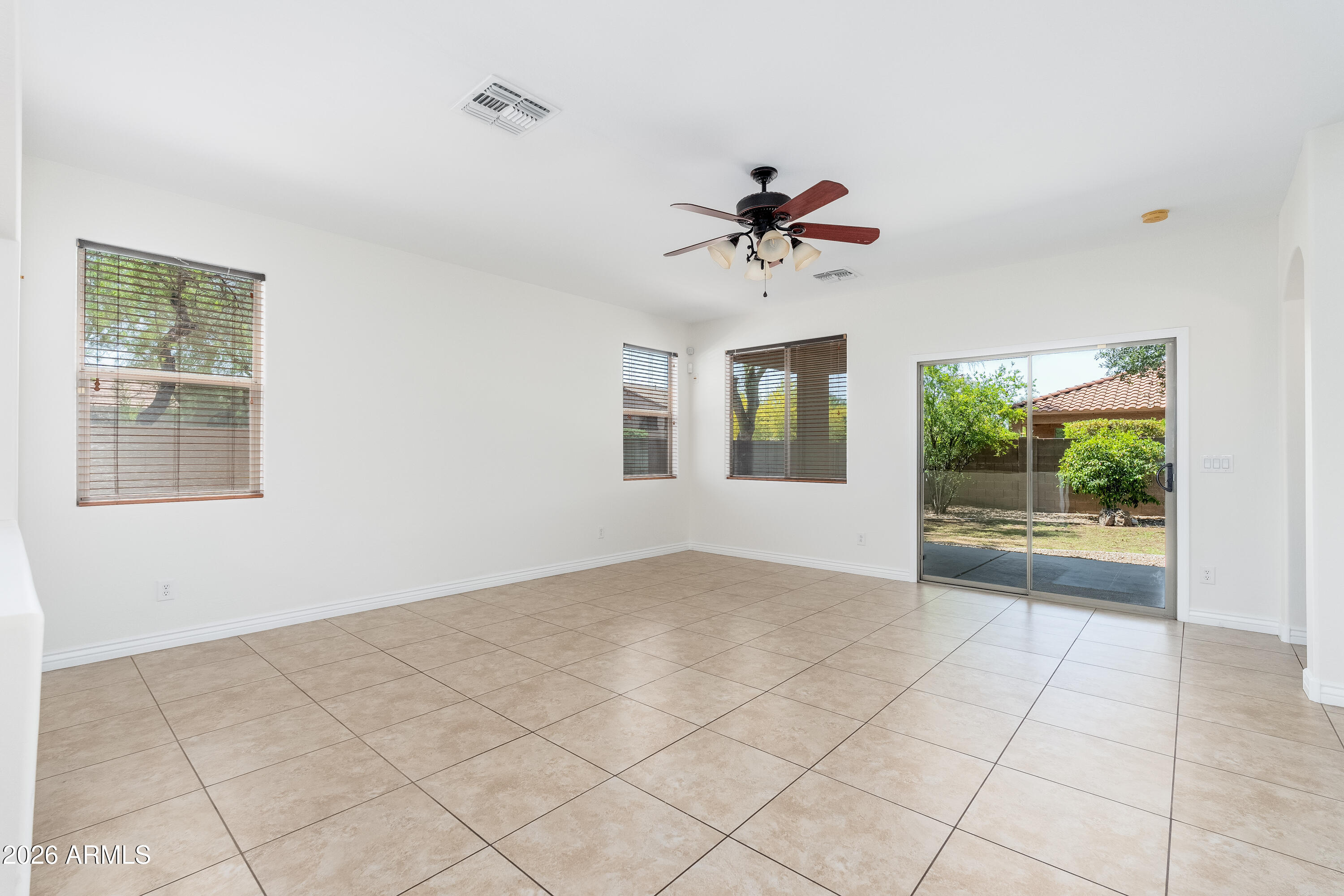4317 East Folgers Road Phoenix, AZ 85050 - Photo 7 of 40 a view of room with a ceiling fan and window