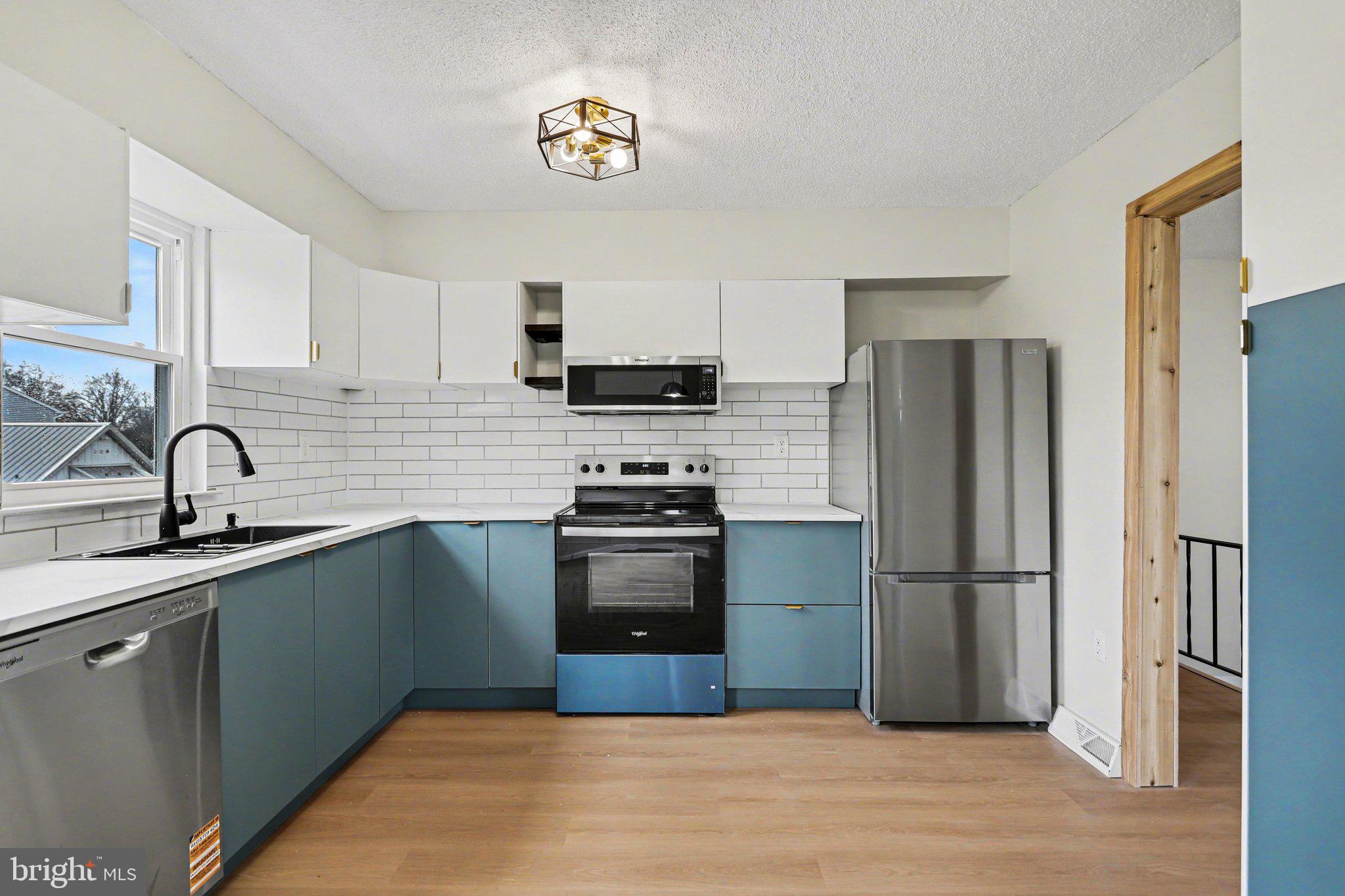 4273 Marlborough Road Dover, PA 17315 - Photo 11 of 29 a kitchen with stainless steel appliances granite countertop a refrigerator sink and stove