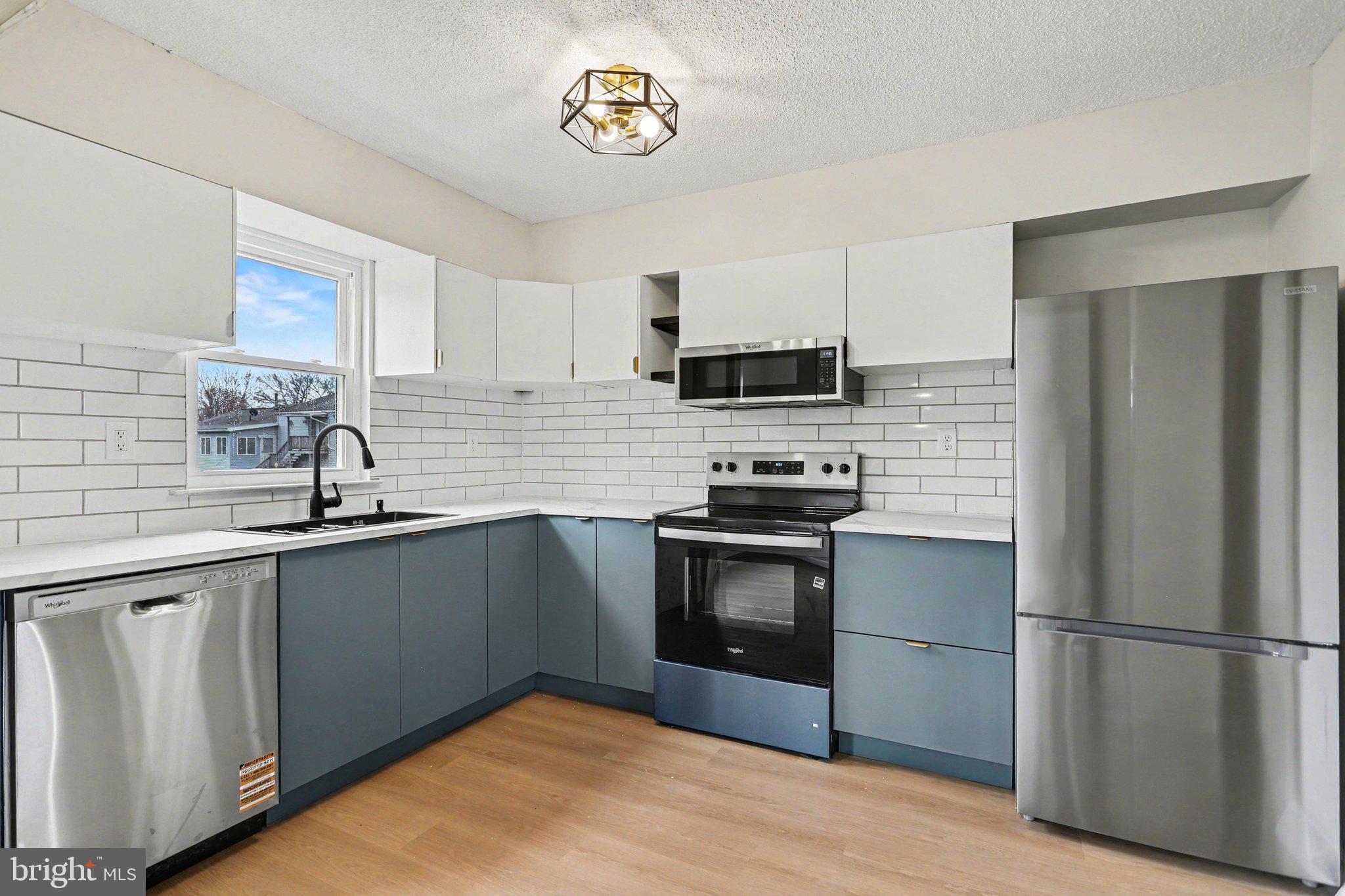 4273 Marlborough Road Dover, PA 17315 - Photo 12 of 29 a kitchen with stainless steel appliances a stove a sink and a refrigerator