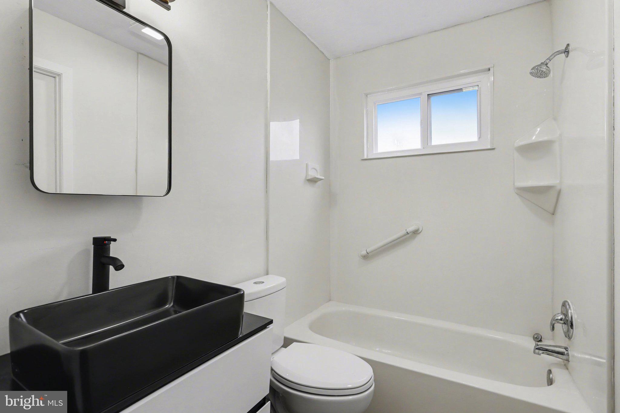 4273 Marlborough Road Dover, PA 17315 - Photo 16 of 29 a bathroom with a toilet a sink and bathtub