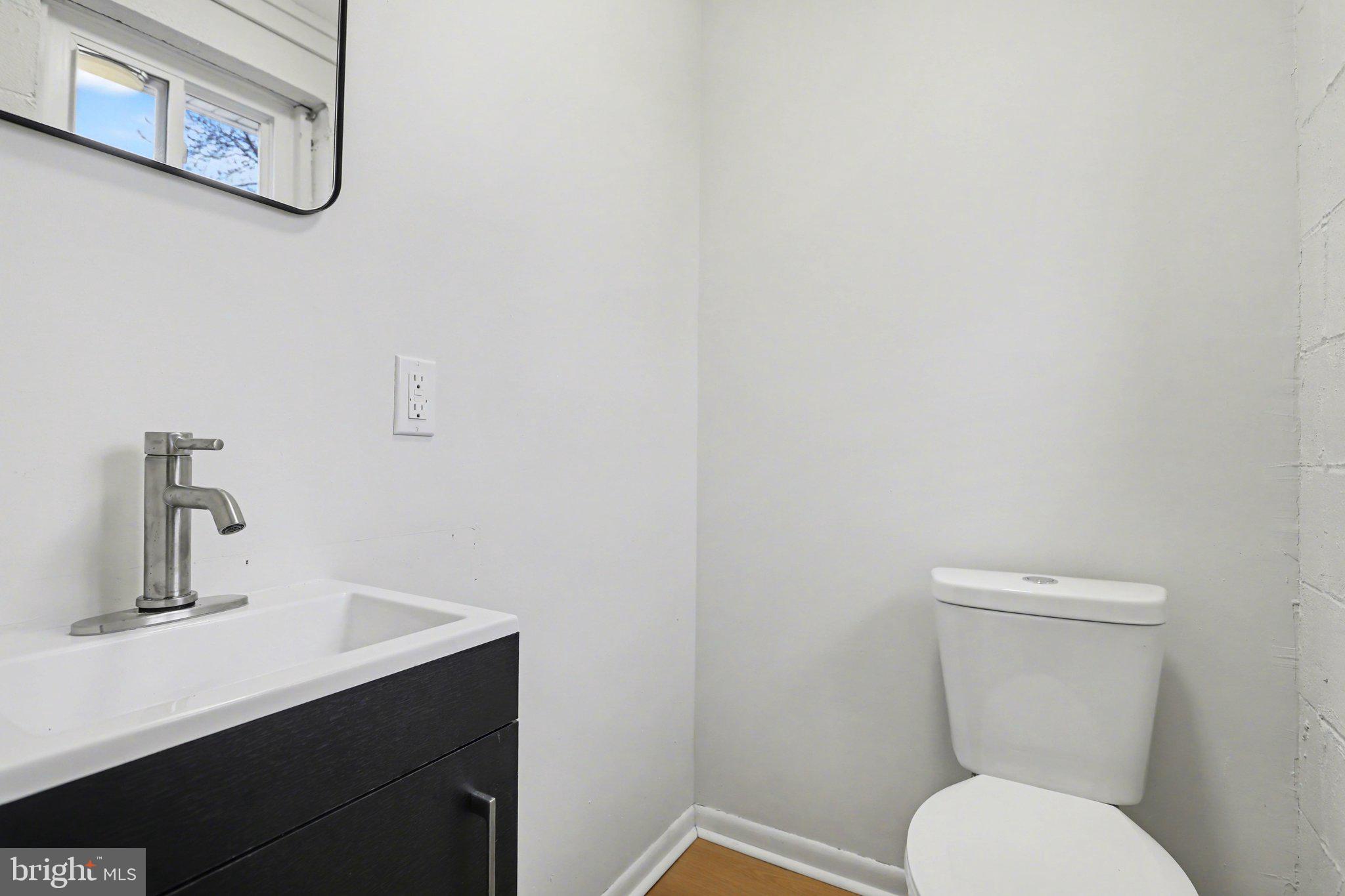 4273 Marlborough Road Dover, PA 17315 - Photo 21 of 29 a bathroom with a toilet sink and mirror