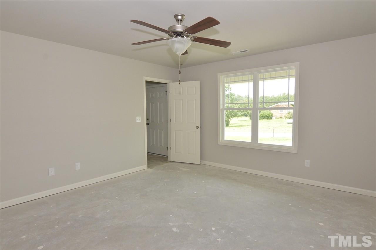 16 Willow Ridge Circle Willow Spring, NC 27592 - Photo 14 of 16 a view of an empty room with a window