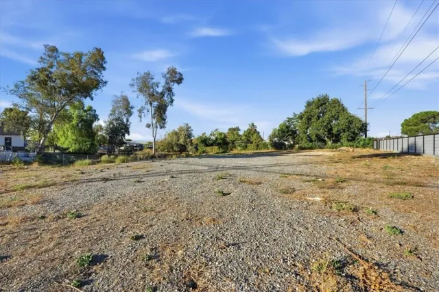 a view of a yard with an trees