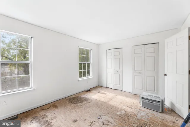 an empty room with windows