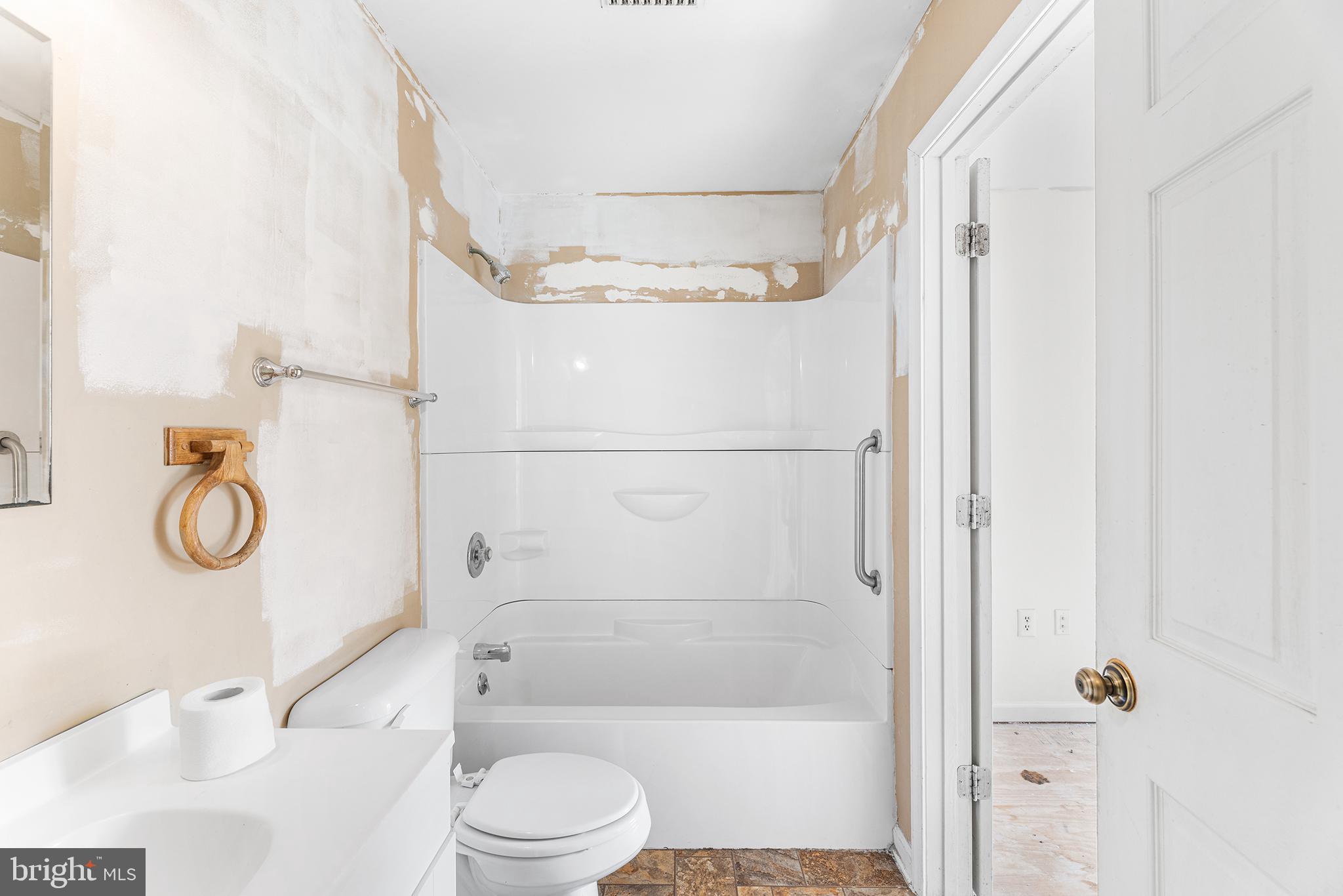 423 Calvert Street Chestertown, MD 21620 - Photo 14 of 20 a bathroom with a toilet a sink and a shower