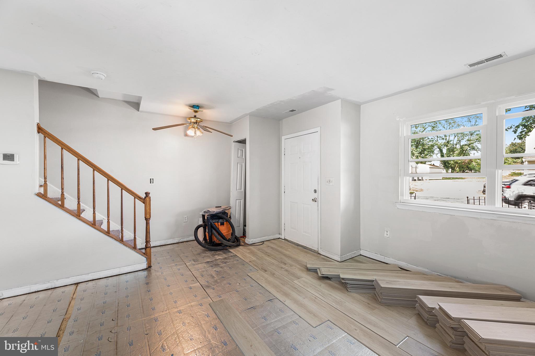 423 Calvert Street Chestertown, MD 21620 - Photo 5 of 20 a view of a livingroom with wooden floor and a window