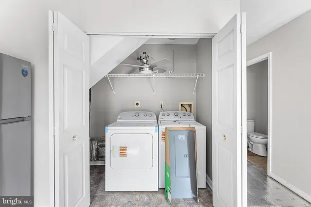 a utility room with dryer and washer