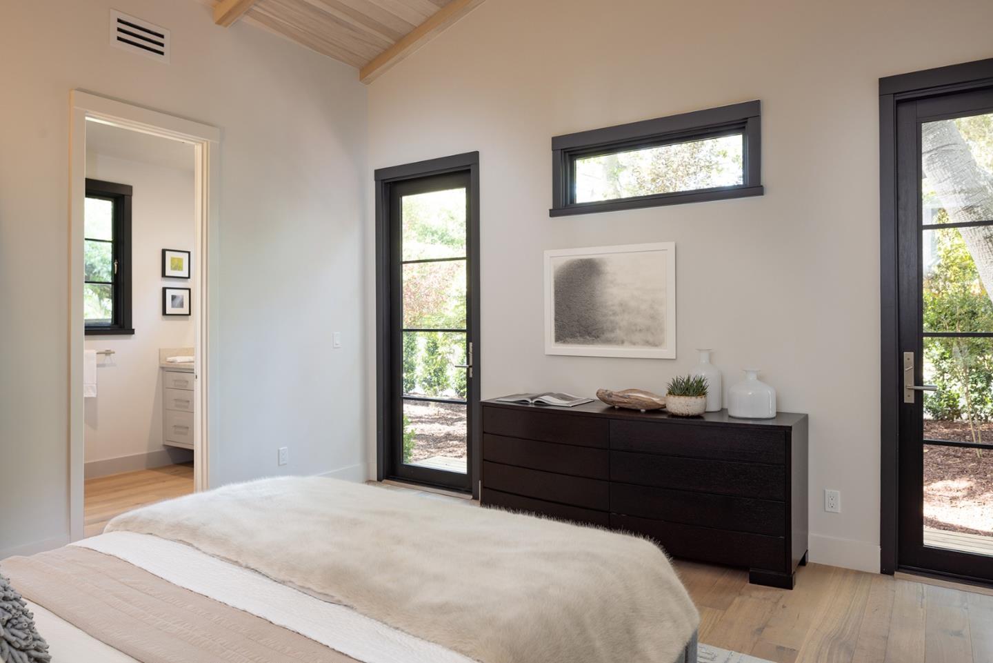 25962 Ridgewood Road Carmel, CA 93923 - Photo 16 of 21 a bedroom with a bed and a window