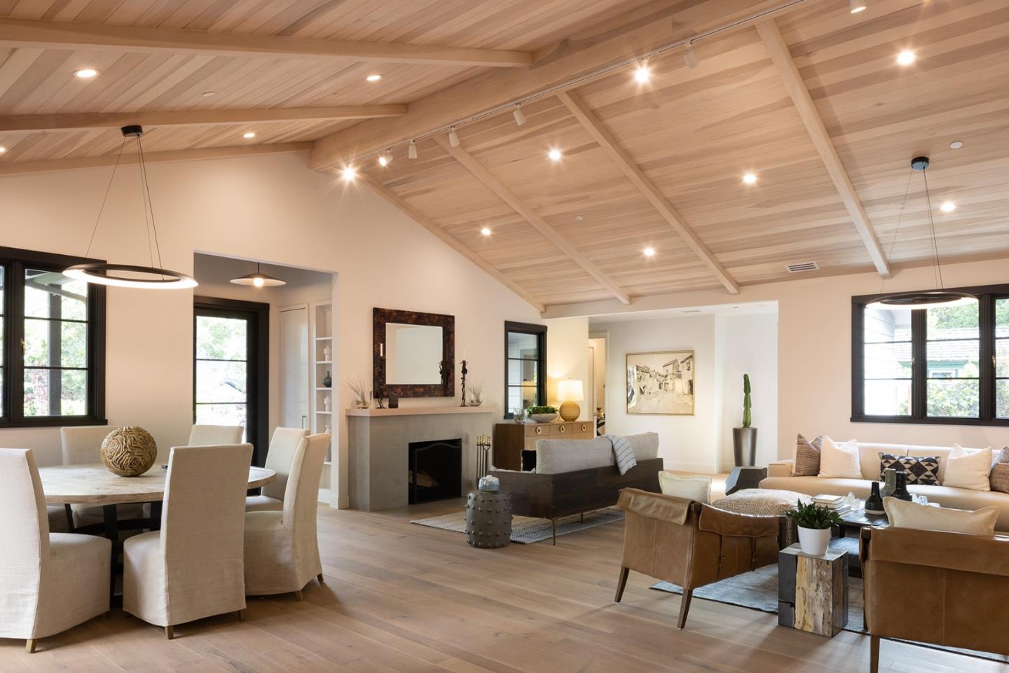 25962 Ridgewood Road Carmel, CA 93923 - Photo 4 of 21 a living room with furniture a fireplace and a chandelier