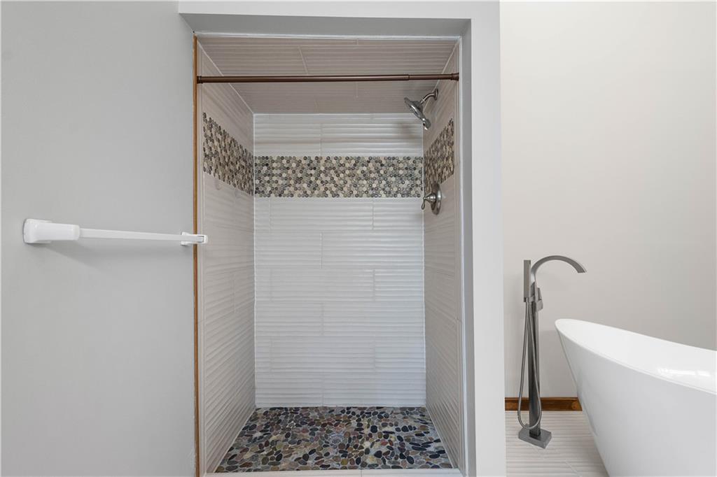 510 West Ingomar Road Pittsburgh, PA 15237 - Photo 29 of 50 A stand-alone soaking tub, tiled walk-in shower, double vanity, skylights, and cathedral ceiling can be found in the primary en-suite bath