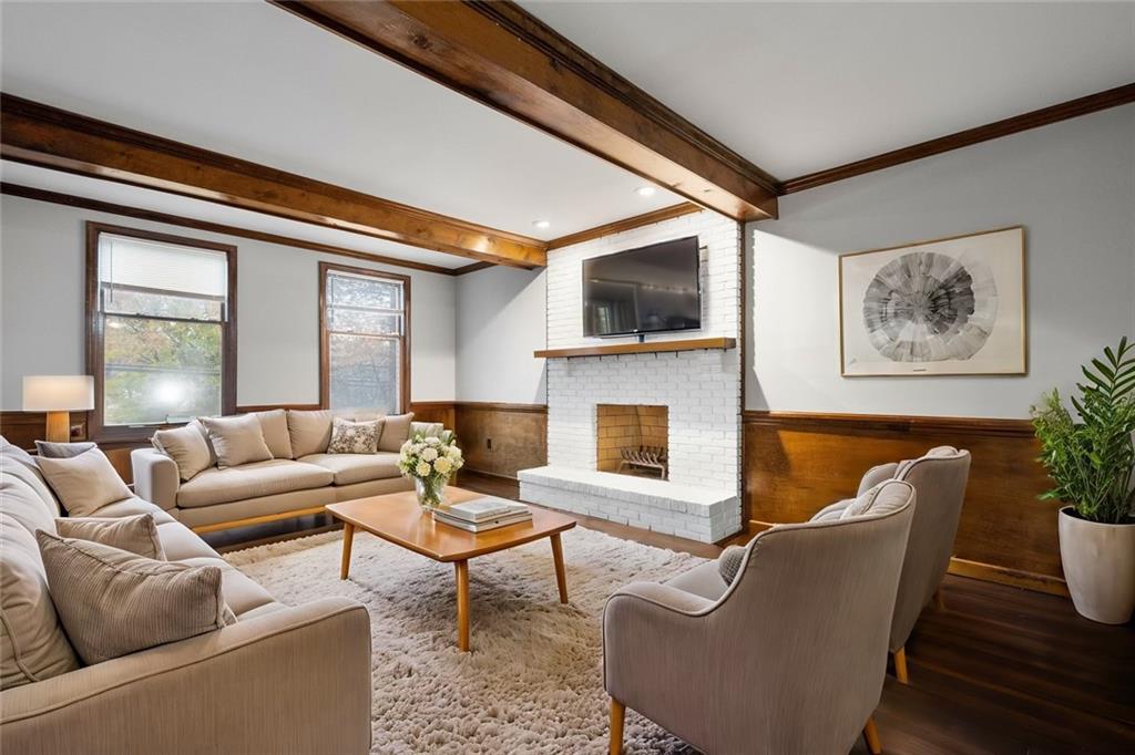 510 West Ingomar Road Pittsburgh, PA 15237 - Photo 5 of 50 The family room boasts rich wood beams, wood flooring, wainscotting, and a cozy fireplace