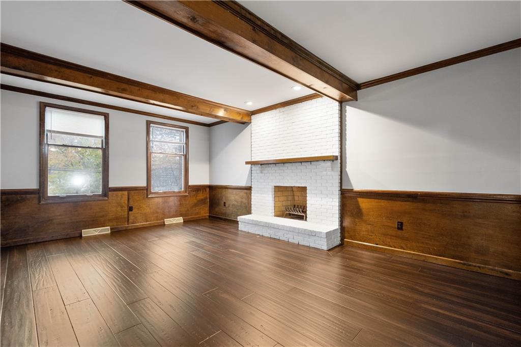 510 West Ingomar Road Pittsburgh, PA 15237 - Photo 6 of 50 The family room boasts rich wood beams, wood flooring, wainscotting, and a cozy fireplace