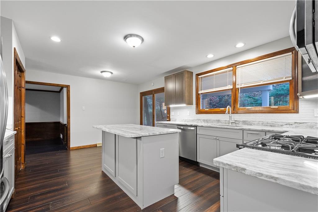 510 West Ingomar Road Pittsburgh, PA 15237 - Photo 9 of 50 The chef's kitchen features two-tone kitchen cabinets, stainless appliances, wood flooring, and quartz countertops