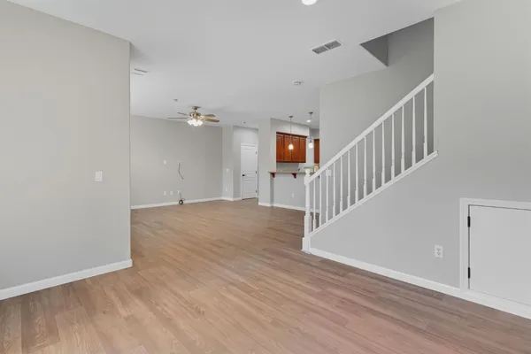 a view of an entryway with wooden floor