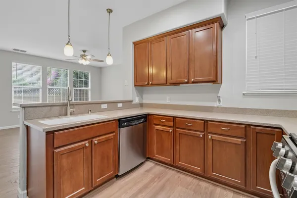 a kitchen with a sink and cabinets