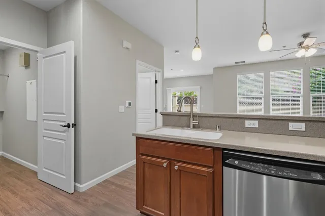 a kitchen with a sink and a window