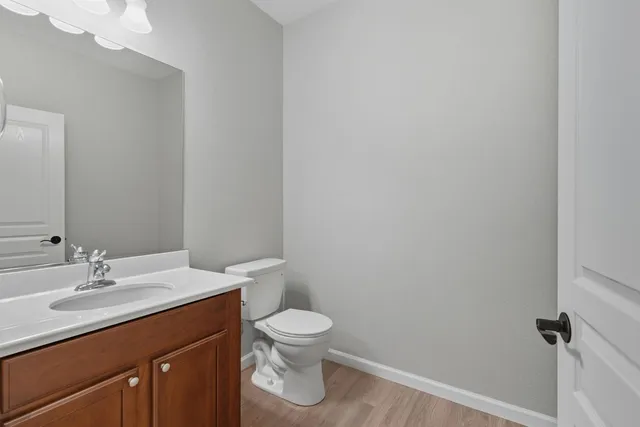 a view of walk in closet with wooden floor
