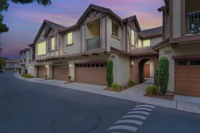 a front view of a house with yard
