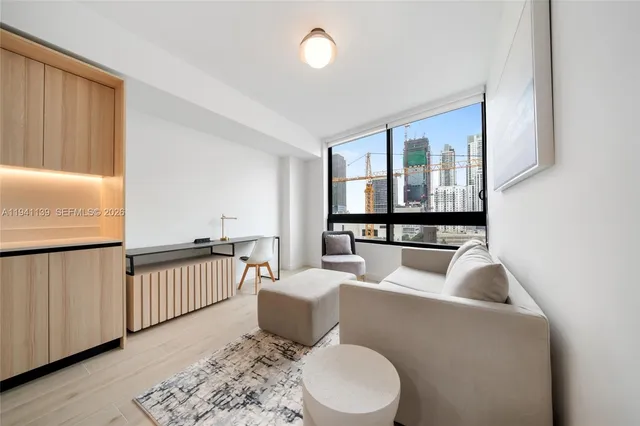 a living room with furniture and a window