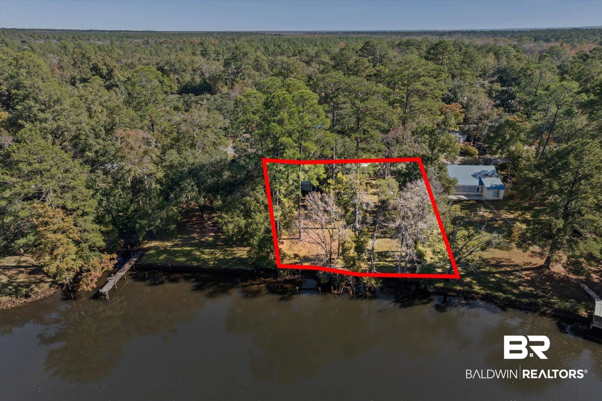 431 Simms Drive Saraland, AL 36571 - Photo 28 of 34 Aerial view of property's location featuring property parcel outlined and a large body of water