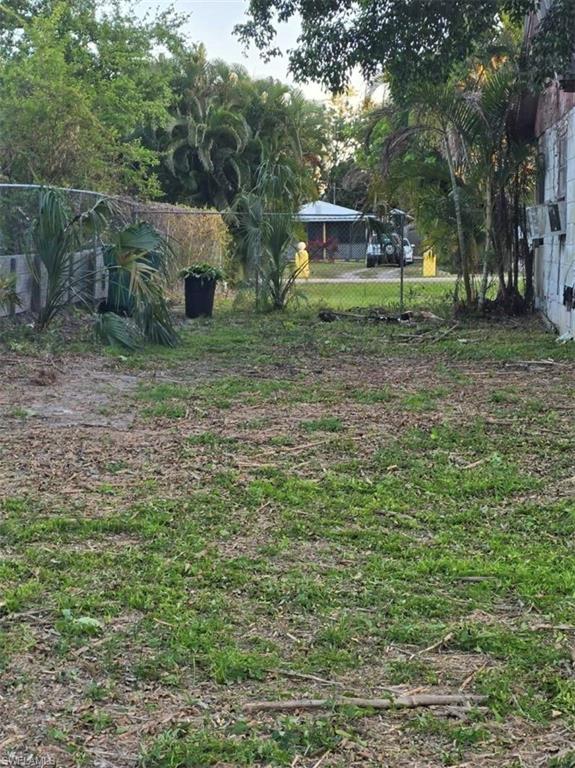 3023 Andrews Avenue Naples, FL 34112 - Photo 6 of 6 a backyard of a house with lots of green space