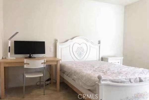 2066 Sentinel Privado Ontario, CA 91764 - Photo 8 of 10 a bedroom with a bed and a flat screen tv