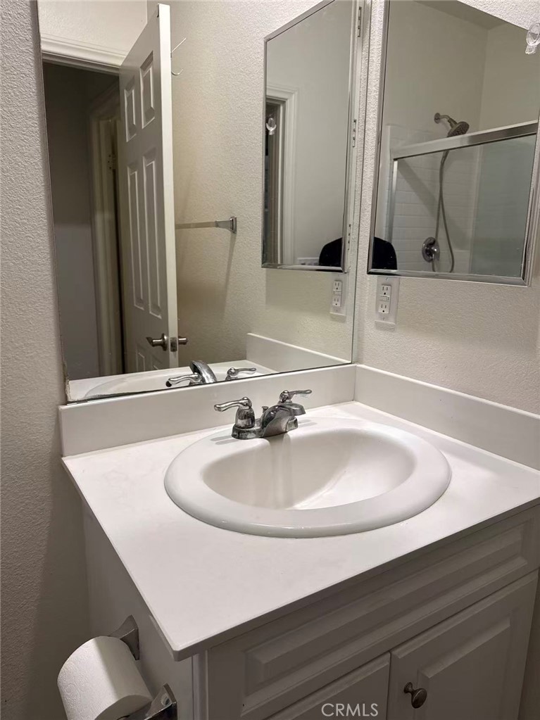2066 Sentinel Privado Ontario, CA 91764 - Photo 9 of 10 a bathroom with a sink and a mirror