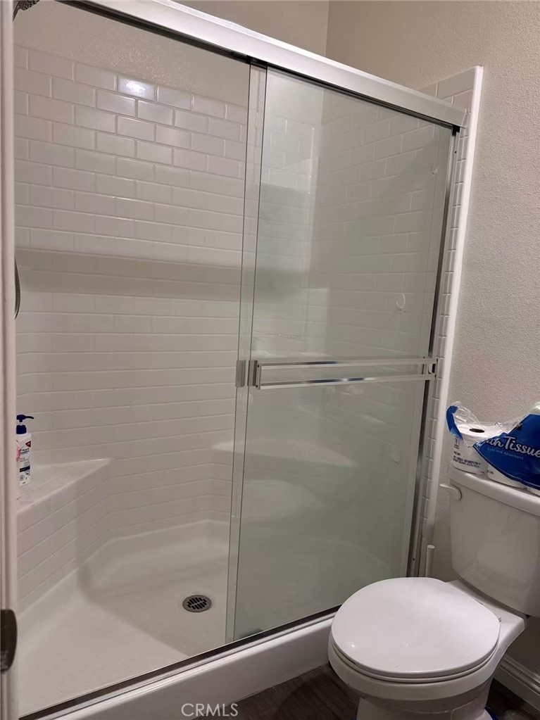 2066 Sentinel Privado Ontario, CA 91764 - Photo 10 of 10 a white toilet sitting next to a bath tub