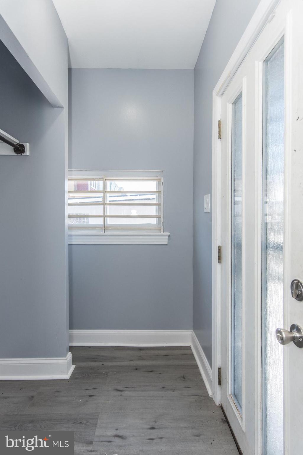 460 Robbins Street Philadelphia, PA 19111 - Photo 11 of 34 a view of an empty room with wooden floor and a window