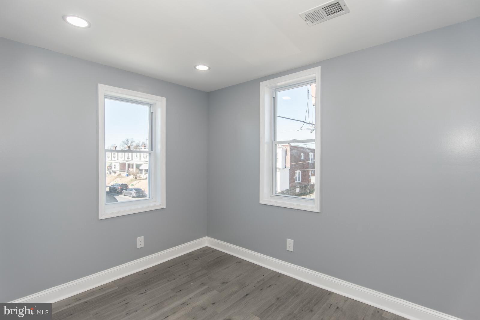 460 Robbins Street Philadelphia, PA 19111 - Photo 16 of 34 a view of an empty room with wooden floor and a window