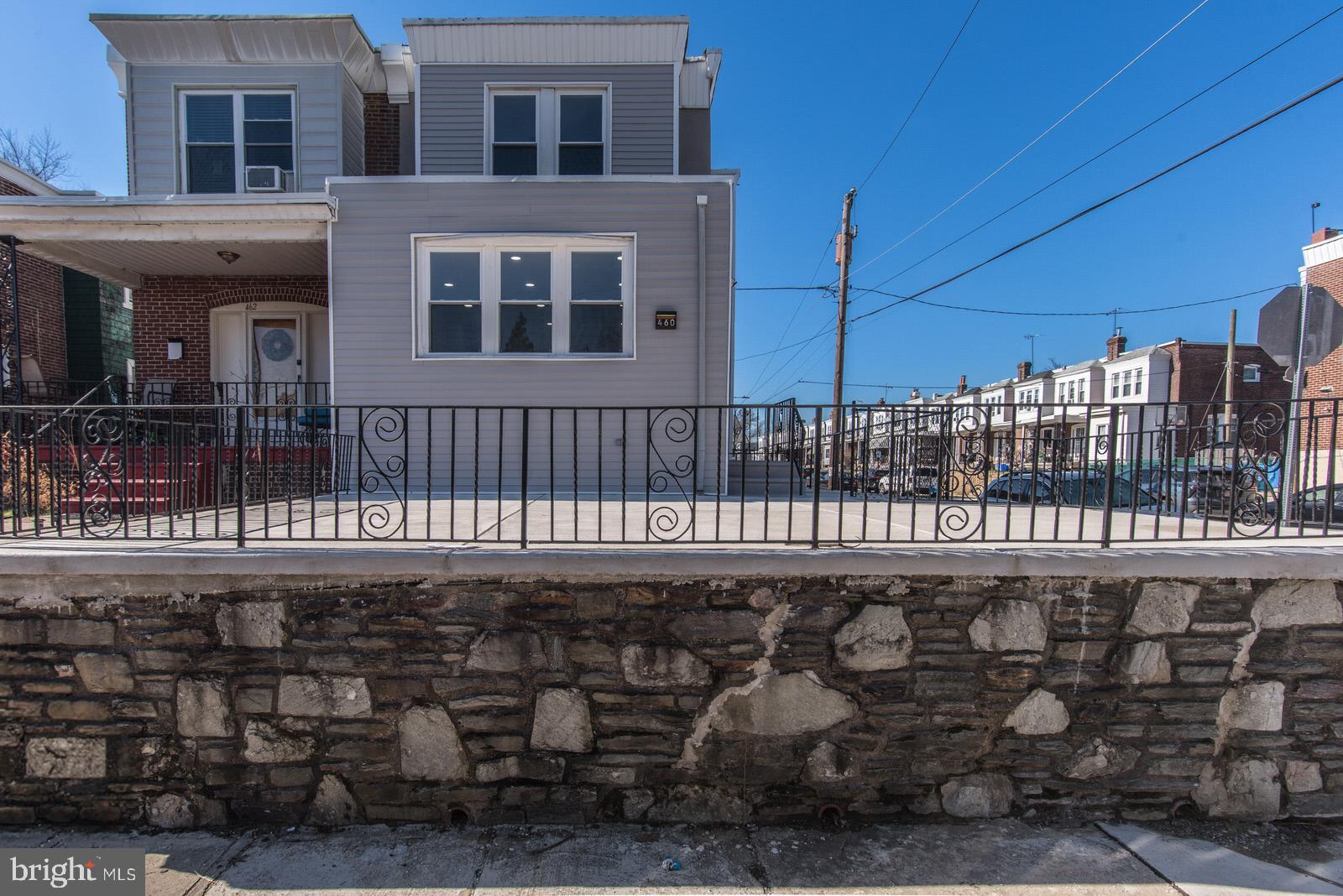 460 Robbins Street Philadelphia, PA 19111 - Photo 2 of 34 a view of a brick house with a small yard