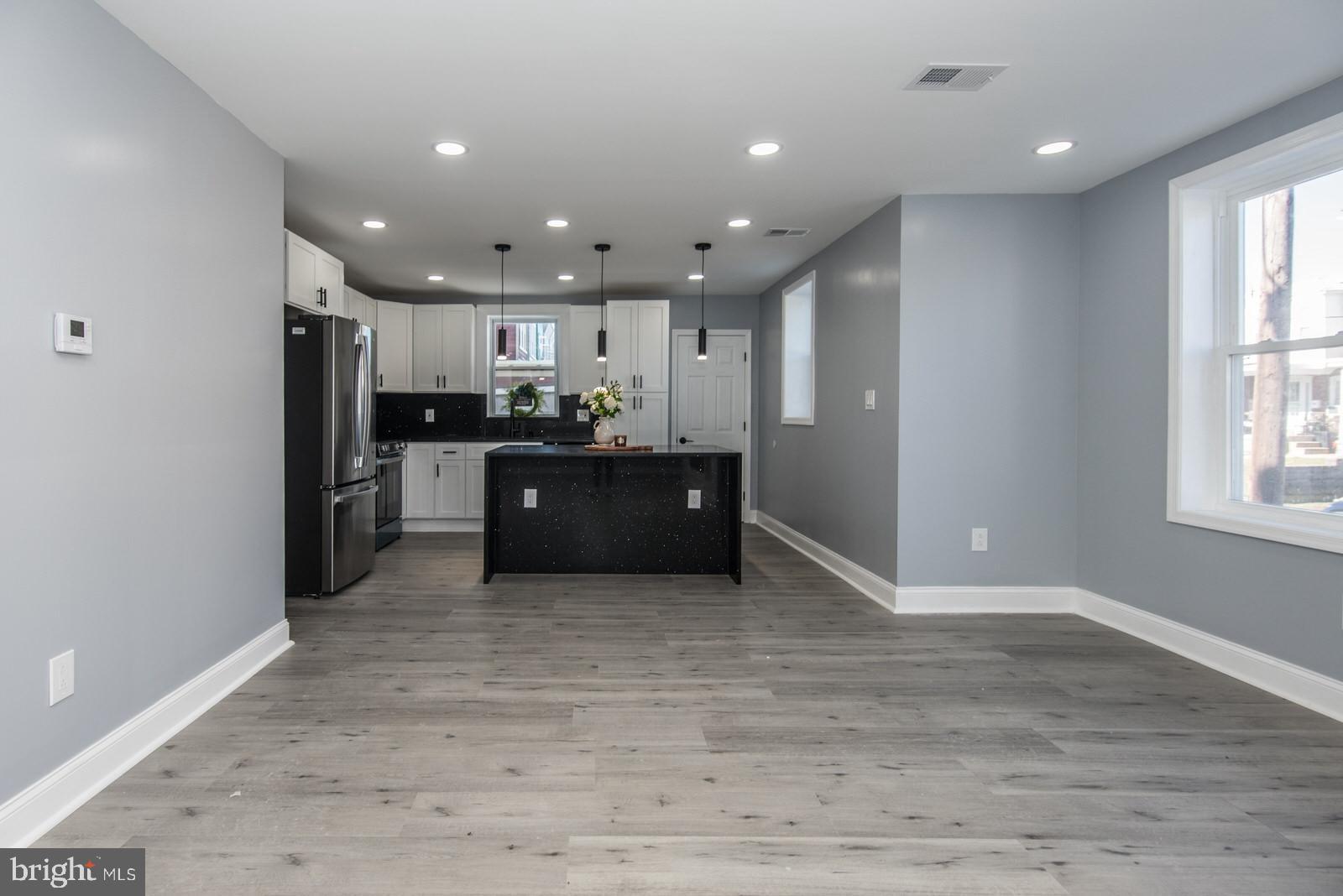 460 Robbins Street Philadelphia, PA 19111 - Photo 6 of 34 a view of kitchen and kitchen with stainless steel appliances wooden floor
