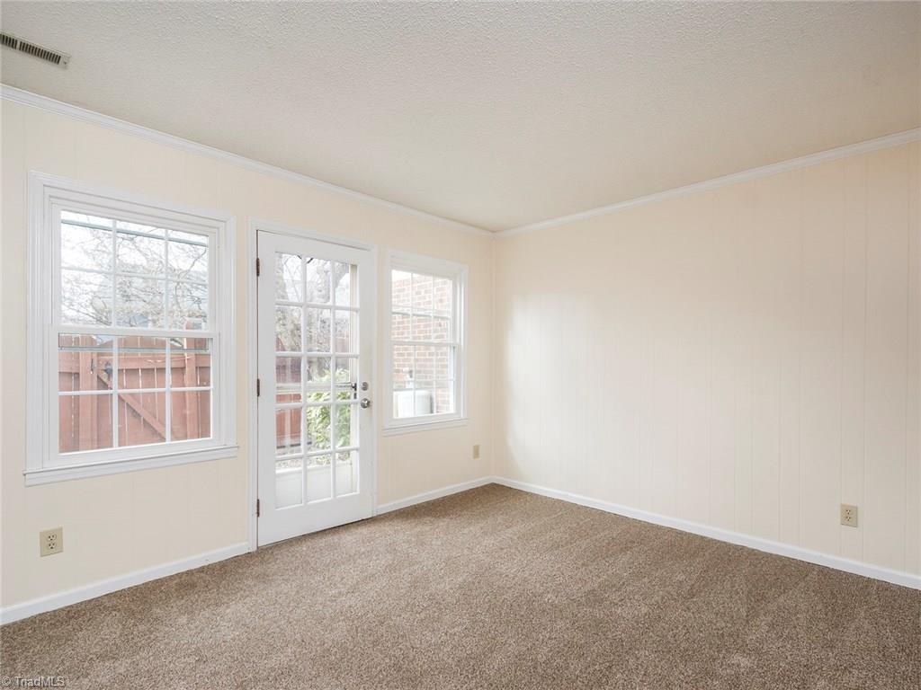 4832 Tower Road, Unit B Greensboro, NC 27410 - Photo 11 of 24 Spacious living room with access to private back patio.