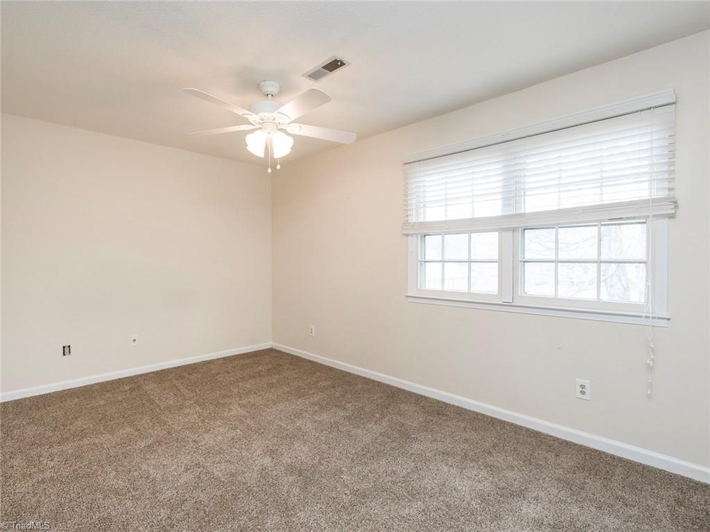 4832 Tower Road, Unit B Greensboro, NC 27410 - Photo 16 of 24 Master Bedroom offers great natural light and a full master bath.