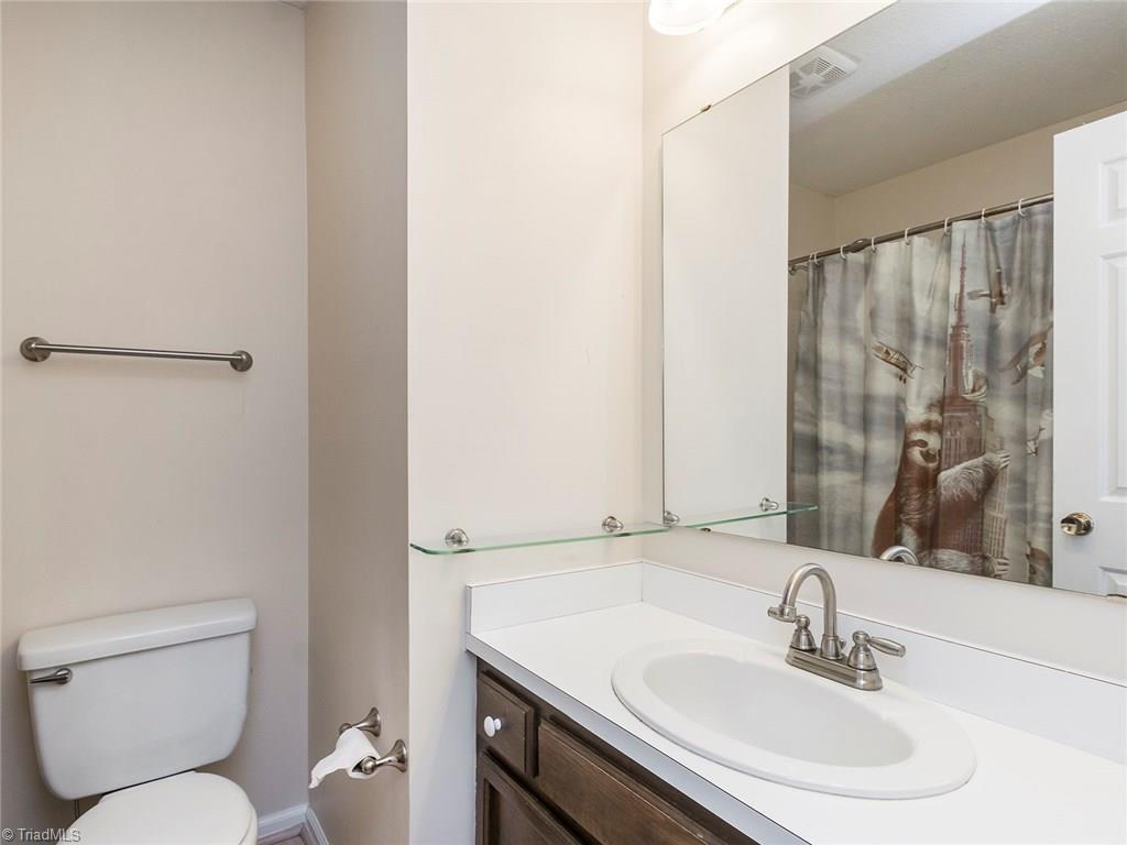 4832 Tower Road, Unit B Greensboro, NC 27410 - Photo 19 of 24 Hall bath offers shower/tub combo.