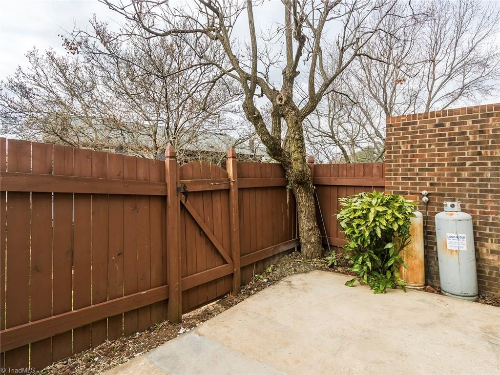 4832 Tower Road, Unit B Greensboro, NC 27410 - Photo 23 of 24 Back fence opens up to greenspace.