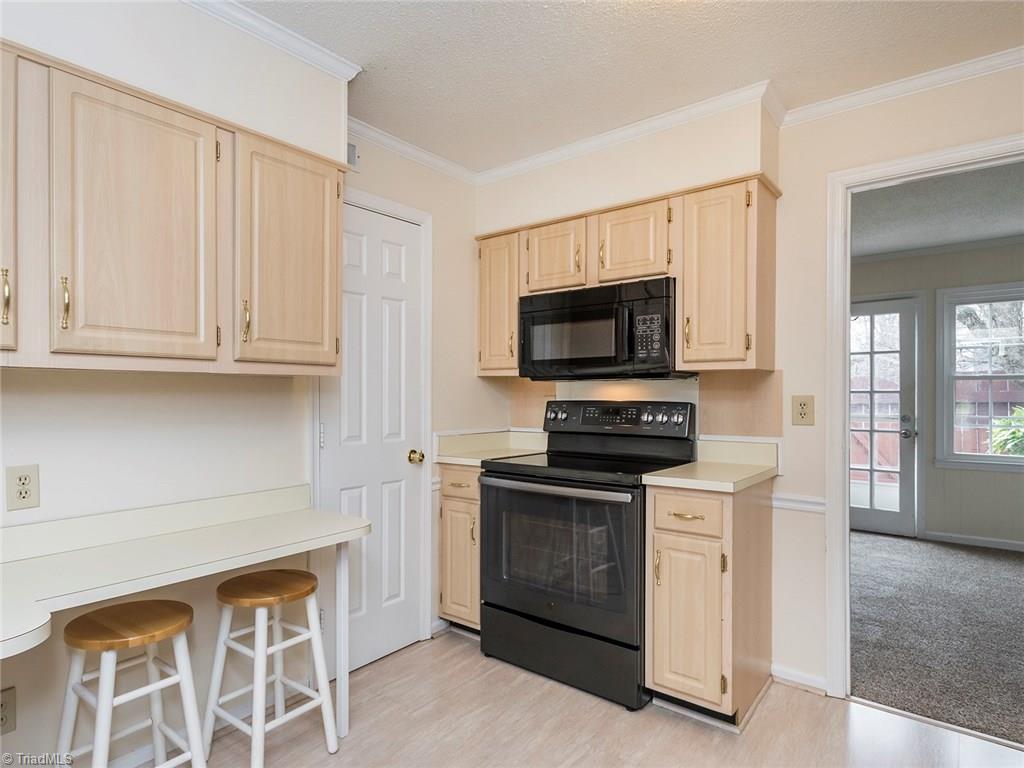 4832 Tower Road, Unit B Greensboro, NC 27410 - Photo 9 of 24 Kitchen offers pantry and great cabinet space!!