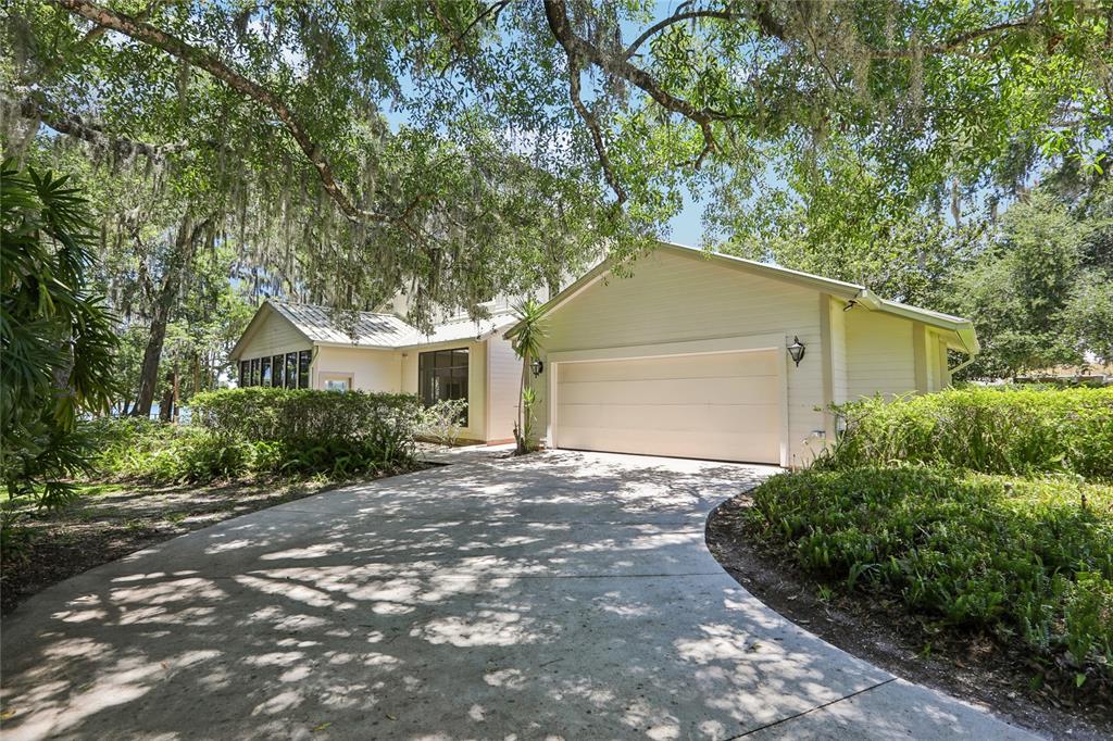 17810 Crawley Road Odessa, FL 33556 - Photo 53 of 76 a front view of house with yard and green space