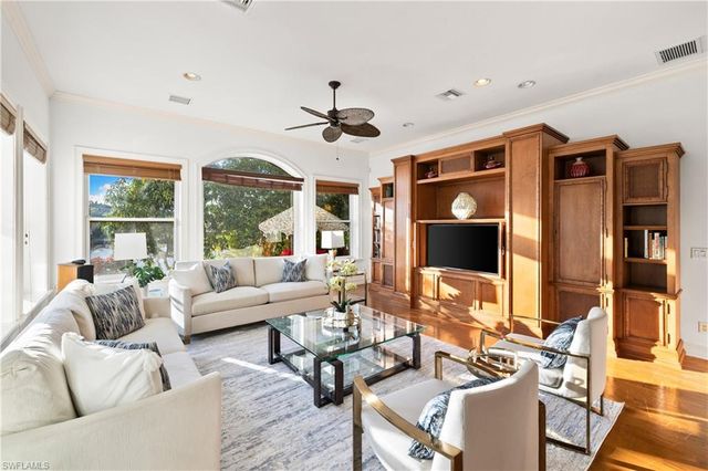 a bed room with a bed and a large window