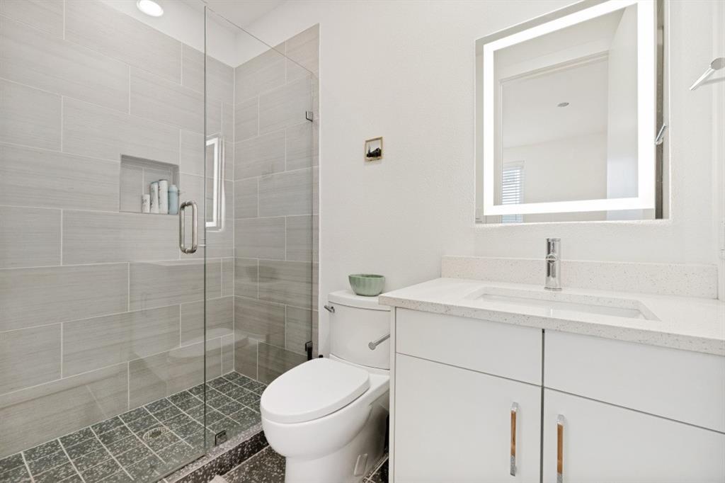 1952 Kearney Court Dallas, TX 75204 - Photo 20 of 24 a bathroom with a sink toilet and shower