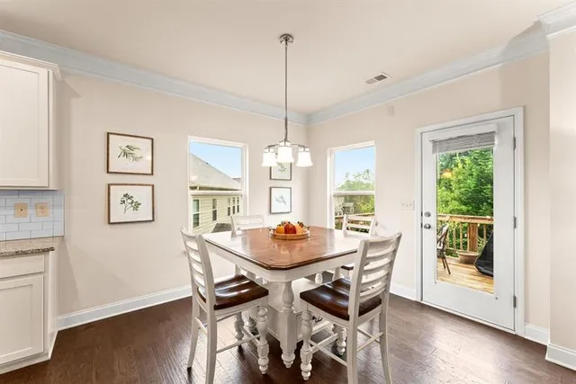 a dining room with furniture window wooden floor
