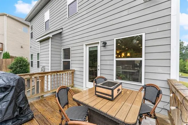 a view of a patio with two chairs and a table