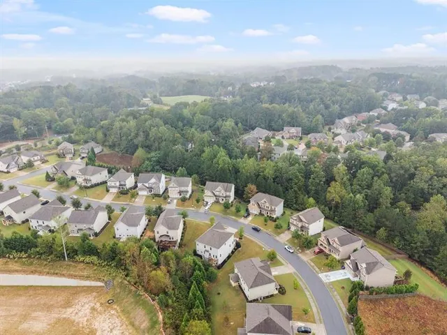 an aerial view of a city with lots of residential buildings