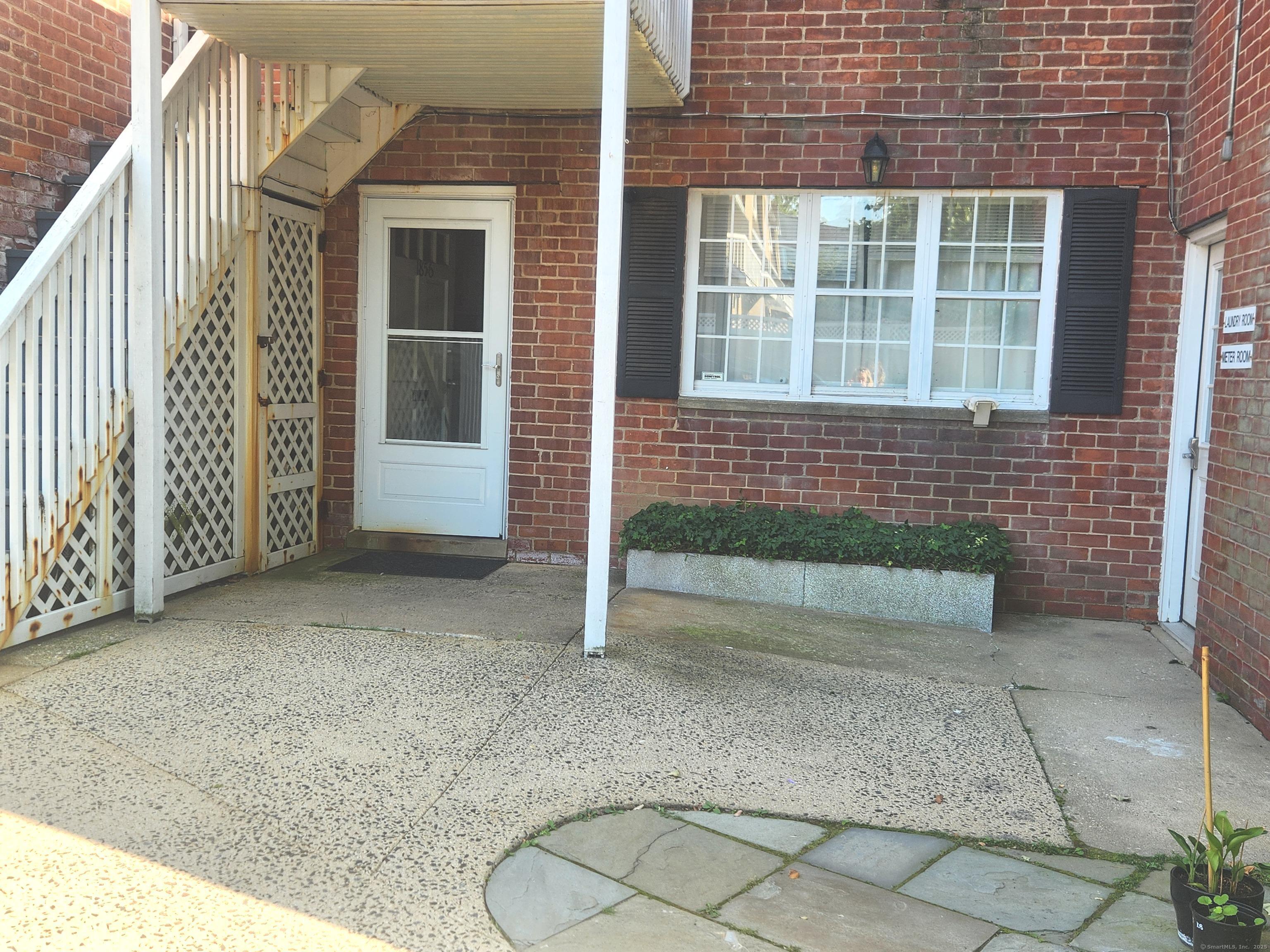 1856 Summer Street, Unit 1856 Stamford, CT 06905 - Photo 11 of 11 a view of front door of house with stairs