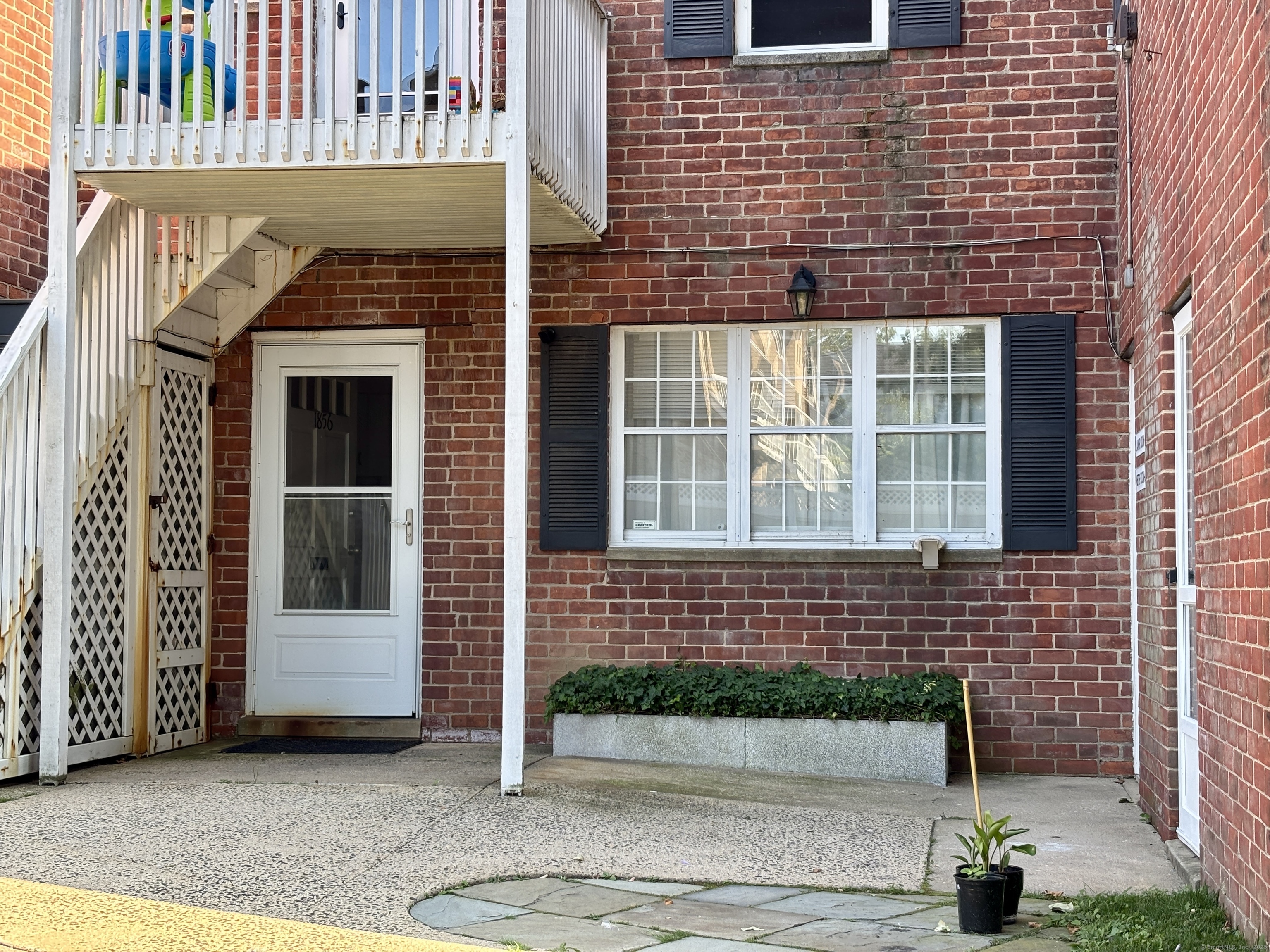 1856 Summer Street, Unit 1856 Stamford, CT 06905 - Photo 2 of 11 a front view of a house with a garage