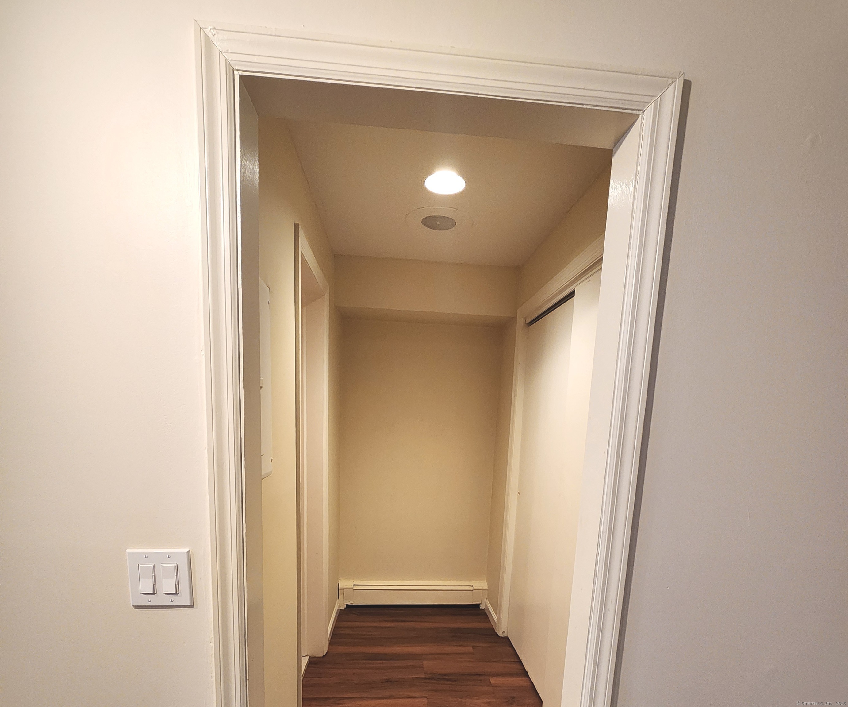 1856 Summer Street, Unit 1856 Stamford, CT 06905 - Photo 6 of 11 a view of a hallway with wooden floor